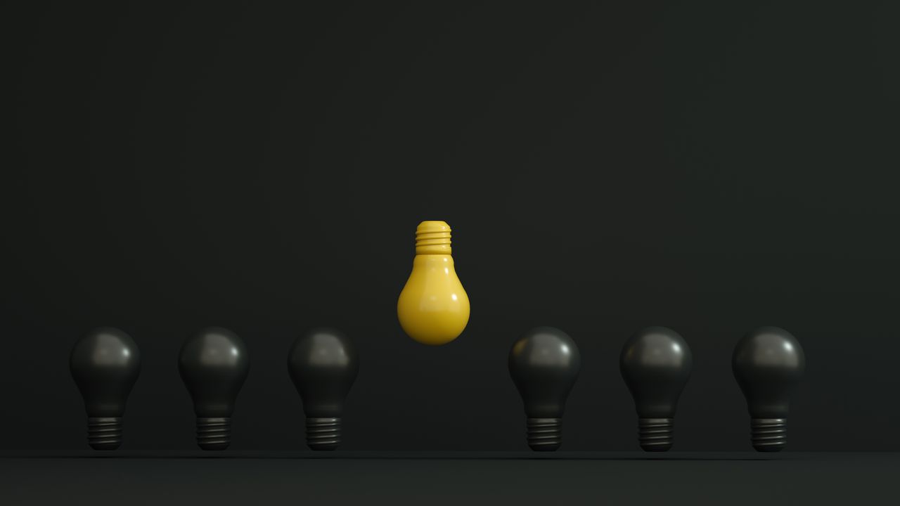 One illuminated lightbulb standing out among unlit ones — the winning test hypothesis